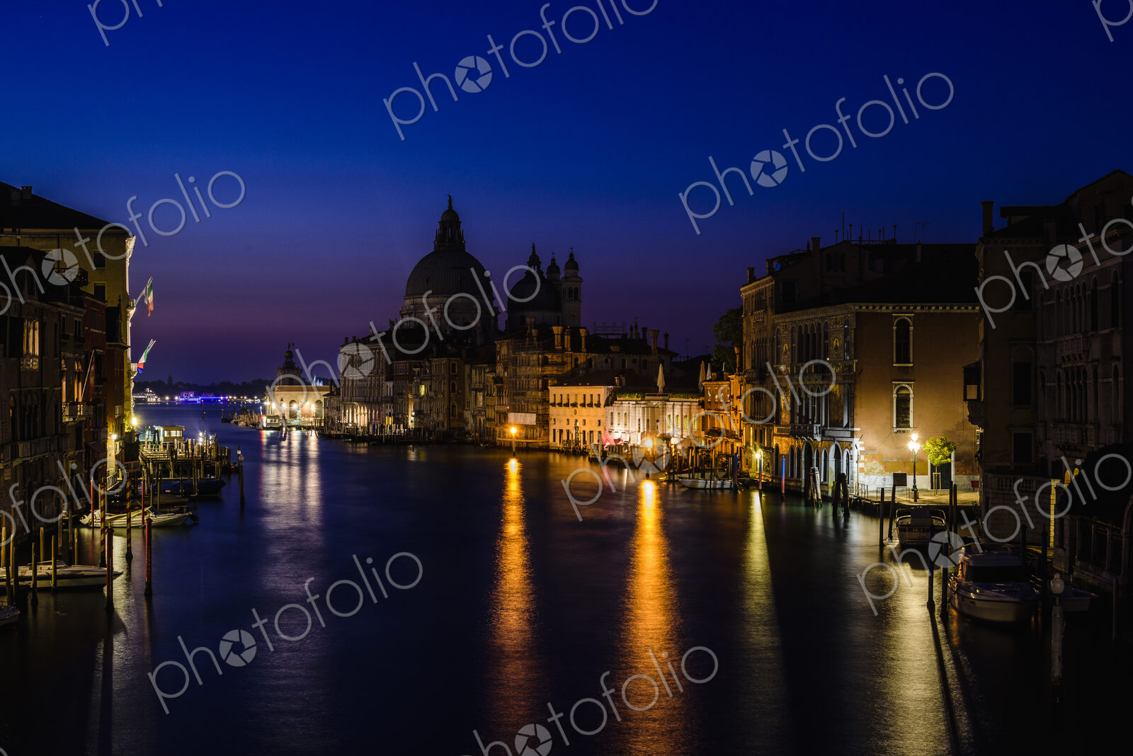 Buildings along canal at night, Venice, Italy