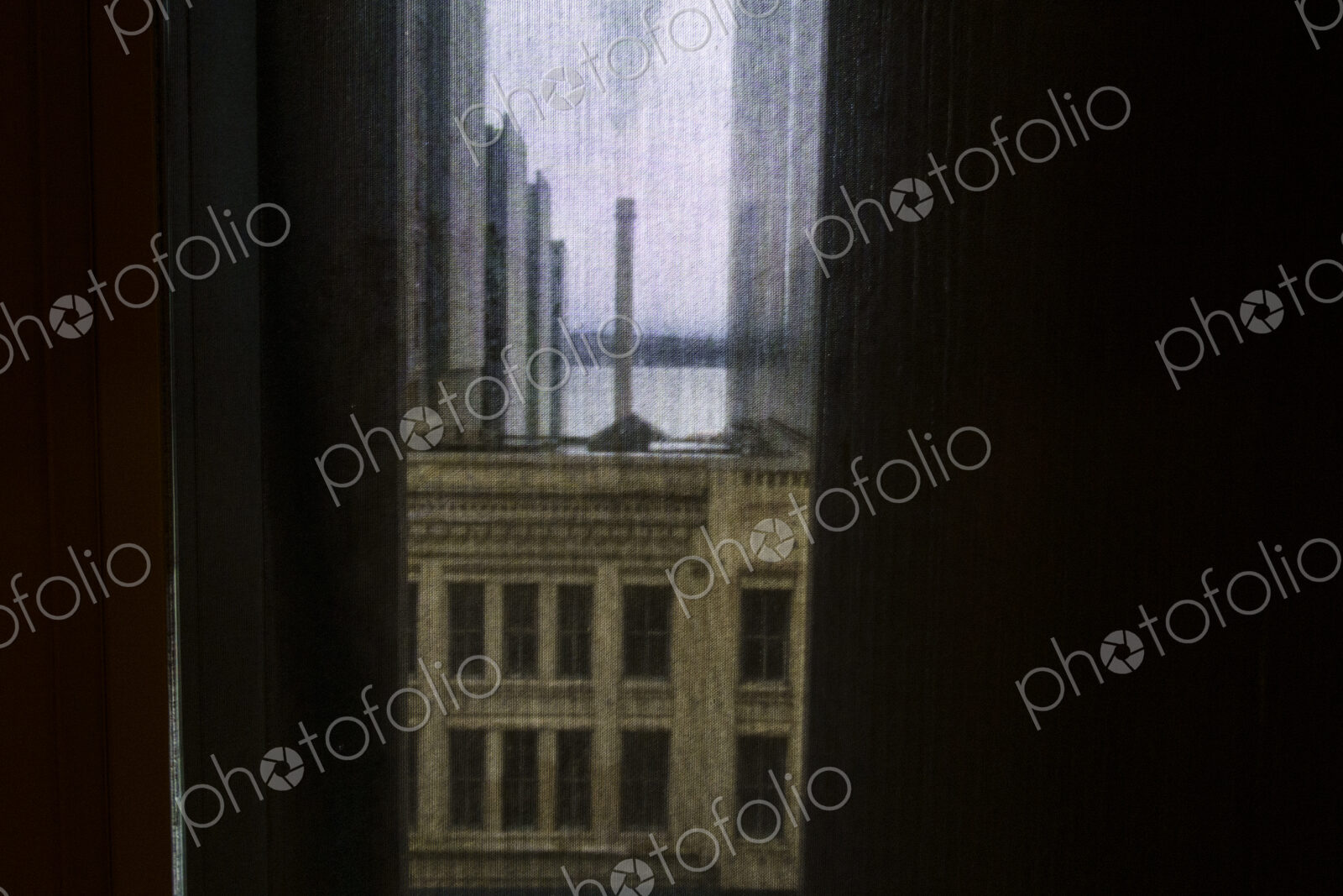 Buildings seen through a window screen, Seattle, WA USA