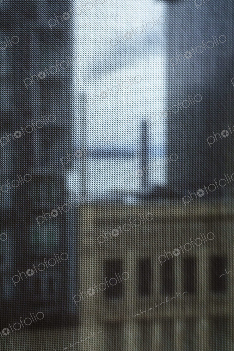 Buildings seen through a window screen, Seattle, WA USA