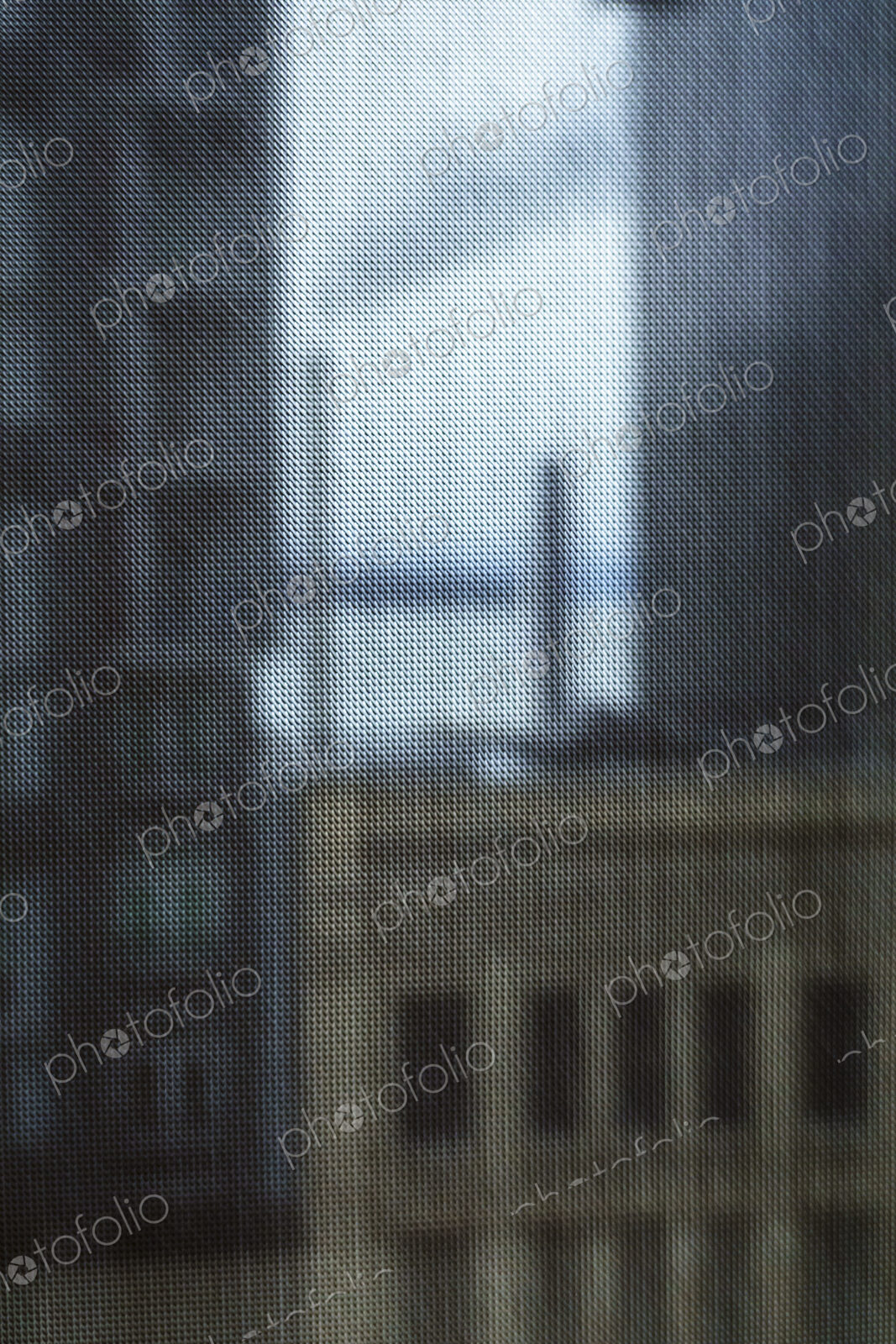 Buildings seen through a window screen, Seattle, WA USA