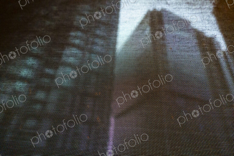 Buildings seen through a window screen, Seattle, WA USA