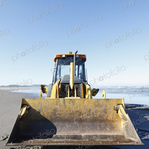 Bulldozer on a sandy beach.