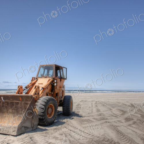 Bulldozer on sandy beach. Bulldozer on sandy beach.