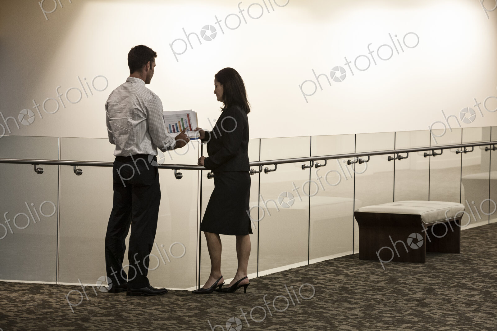Business people in a conference center hallway.
