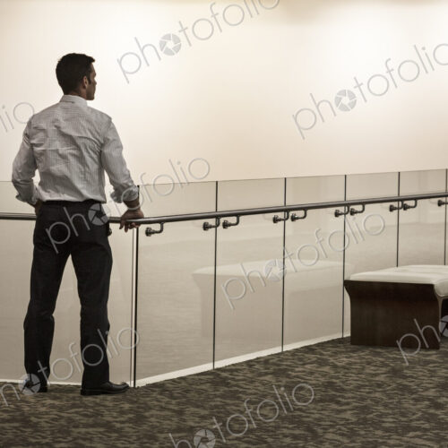 Businessman in a business center hallway