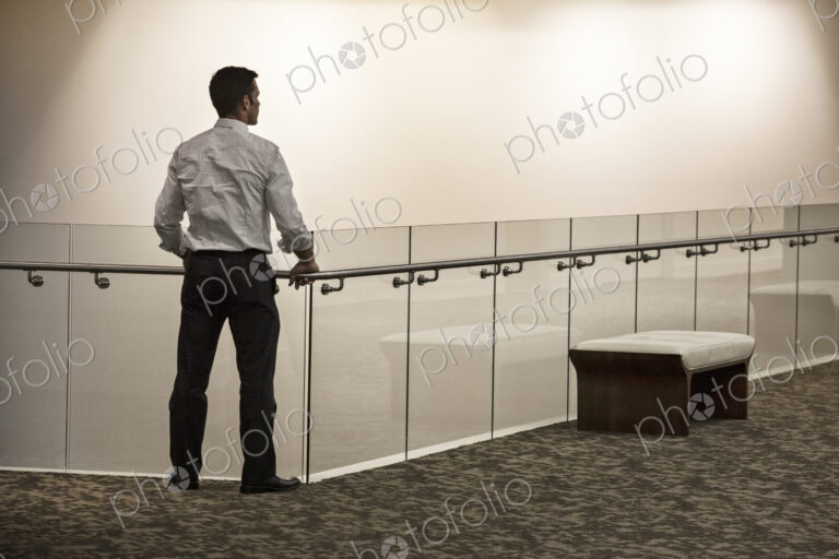 Businessman in a business center hallway