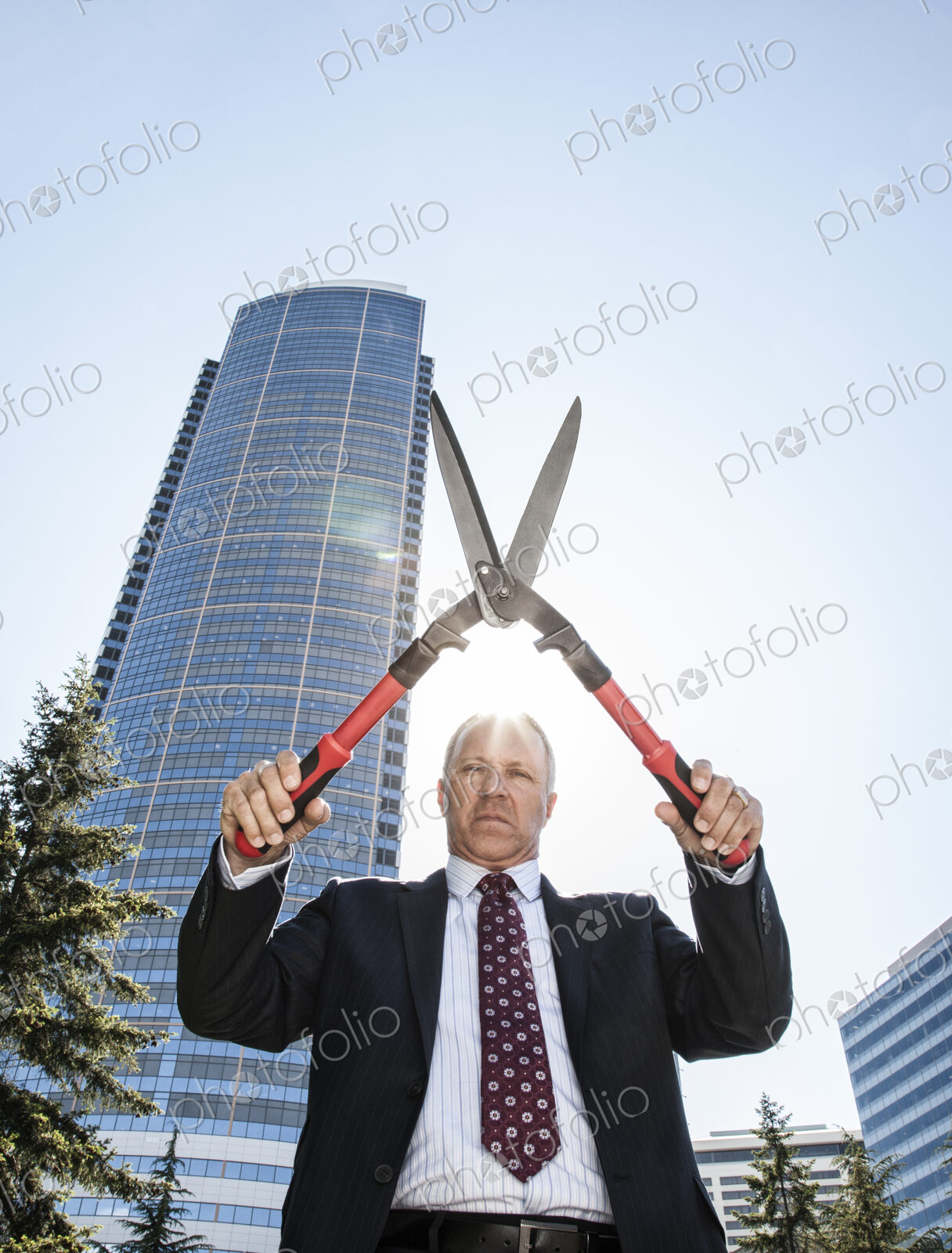 Businessman with landscape sissor pruner.