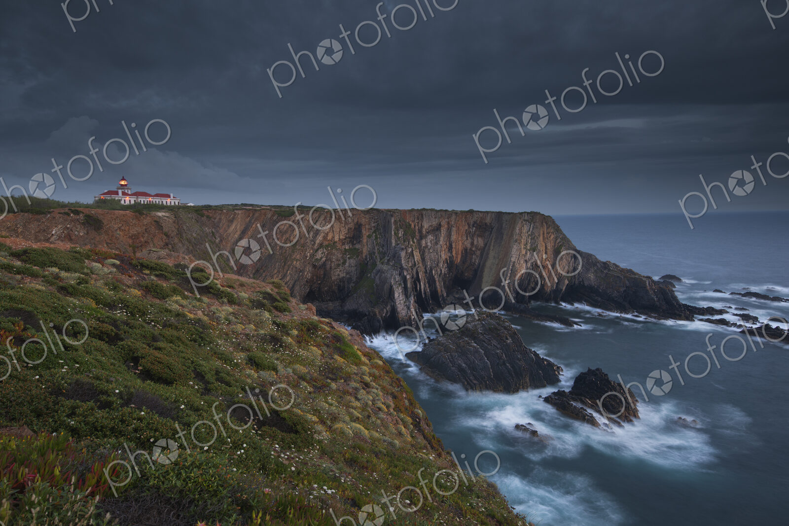 Cabo Sardao Lighthouse is a historic light on the cliffs along the coast of the Cabo…