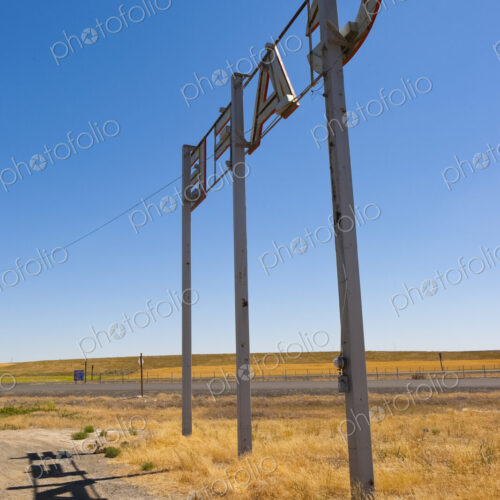 Cafe Sign by the roadside in a desert landscape. Cafe Sign by the roadside in a desert landscape.