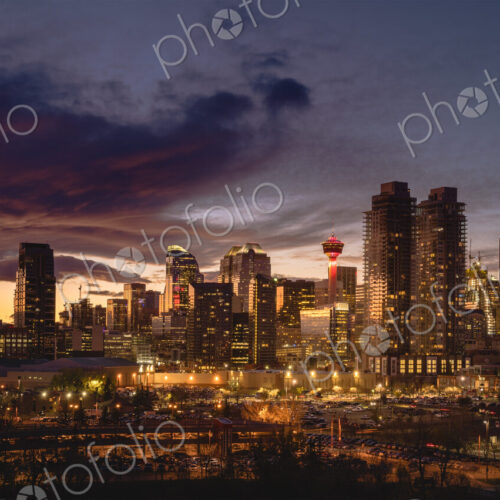 Calgary cityscape lit up at sunset.