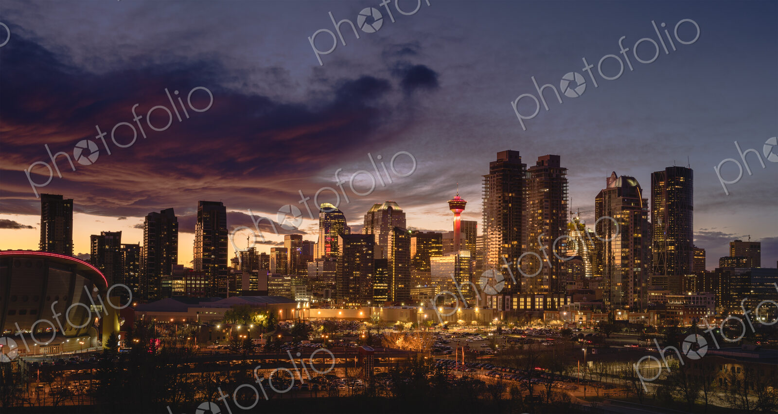 Calgary cityscape lit up at sunset.