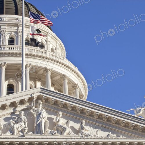 California State Capitol Building with American and California flags, Sacramento. California State Capitol Building with American and California flags, Sacramento.