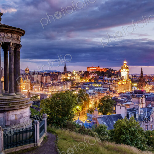 Calton Hill Folly and Edinburgh skyline lit up at dawn. Calton Hill Folly and Edinburgh skyline lit up at dawn.
