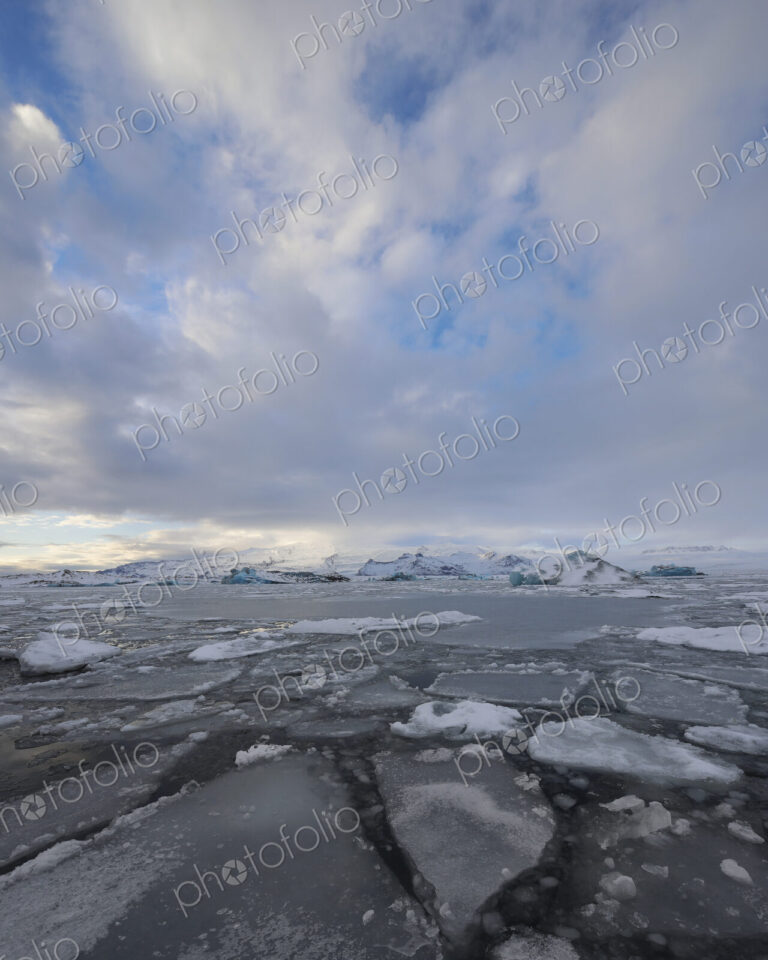 Calved Ice blocks and floes in the Jökulsárlón Glacier Lagoon created by water from…