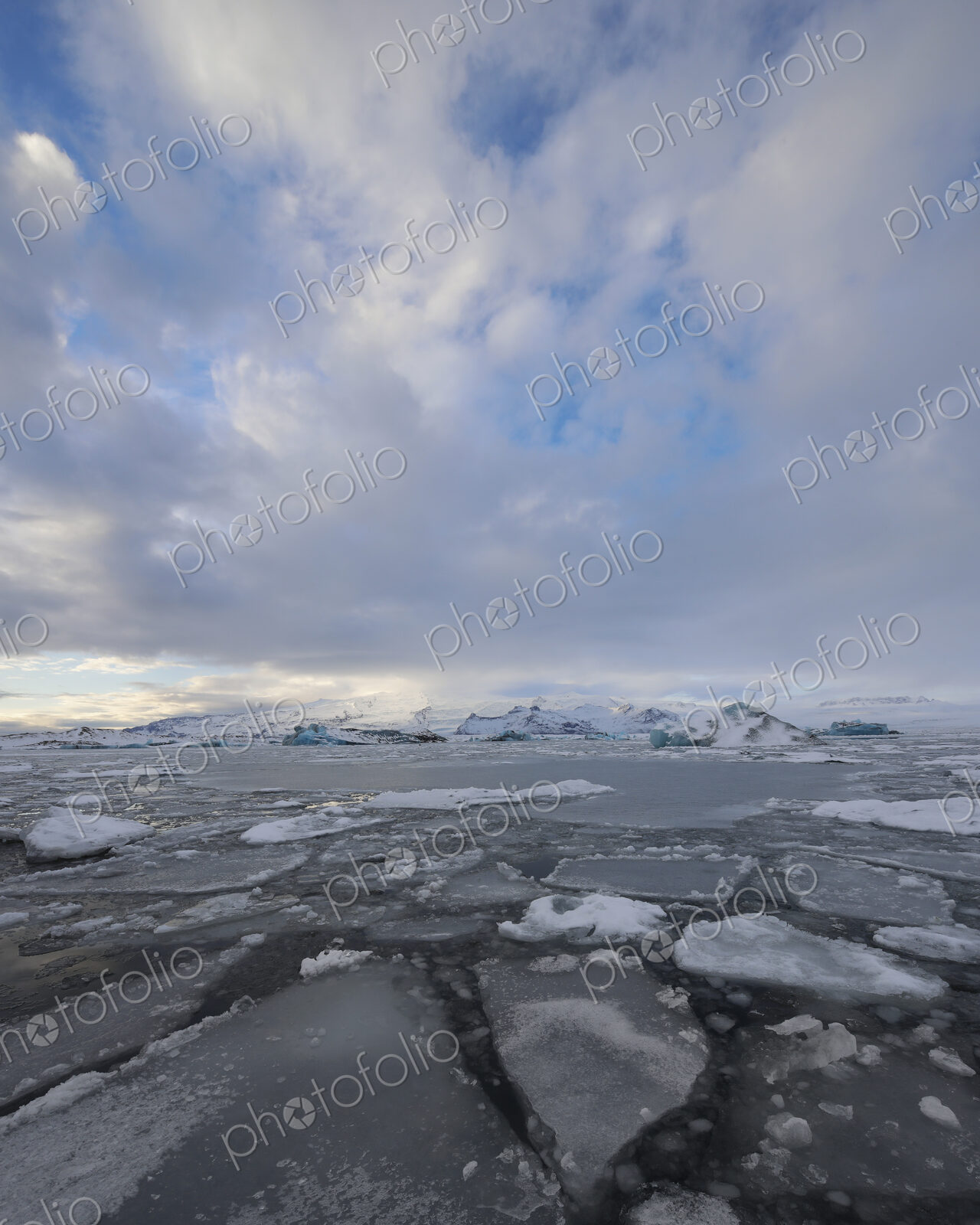 Calved Ice blocks and floes in the Jökulsárlón Glacier Lagoon created by water from…