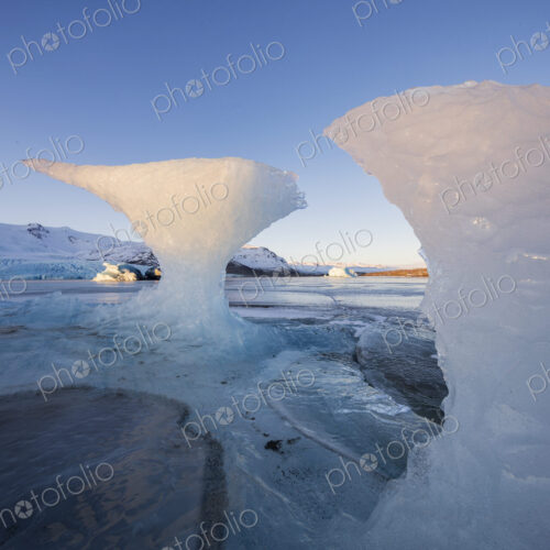 Calved Ice on Jokulsarlon Black Sand Beach, chunks of glacier ice in the lagoon,…