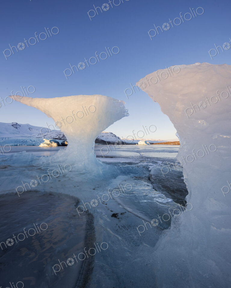 Calved Ice on Jokulsarlon Black Sand Beach, chunks of glacier ice in the lagoon,…