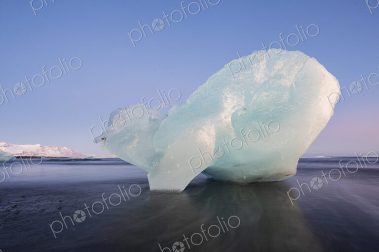 Calved Ice on Jokulsarlon Black Sand Beach, chunks of glacier ice in the lagoon,…