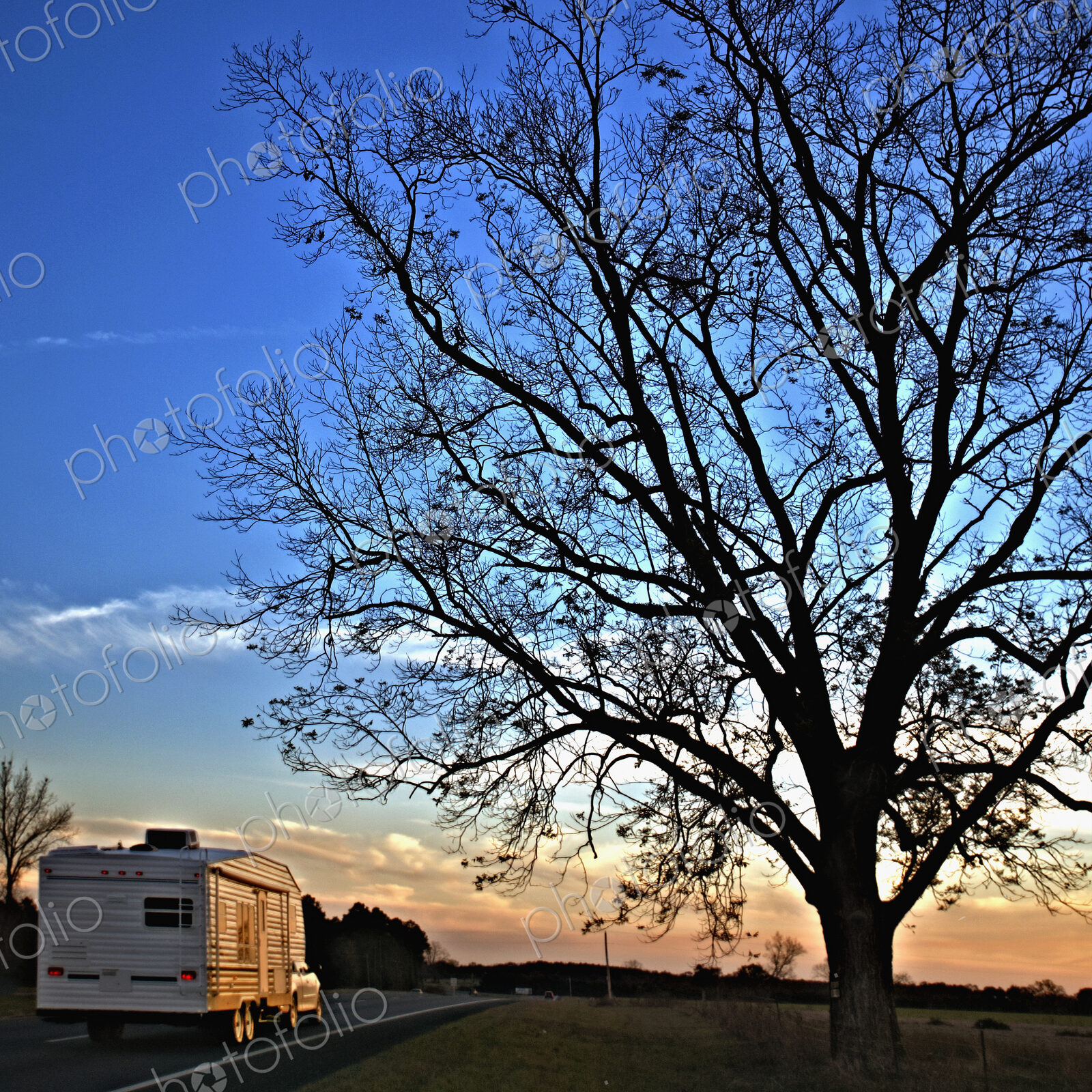 Camper Driving Down a Country Road