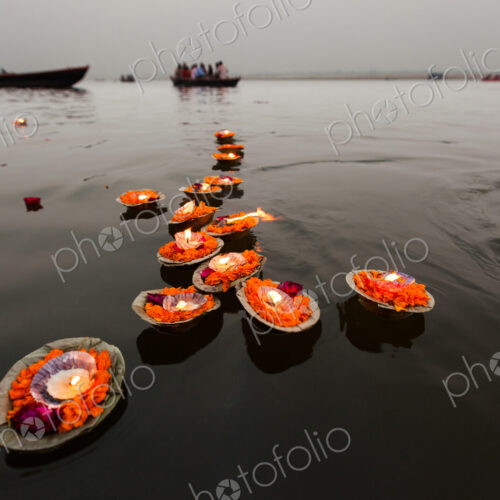 Candles floating in the Ganges River, Varanasi, India
