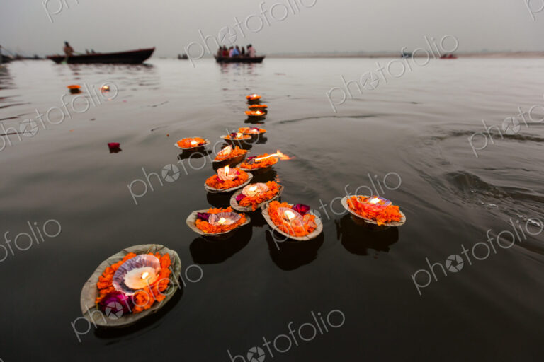 Candles floating in the Ganges River, Varanasi, India