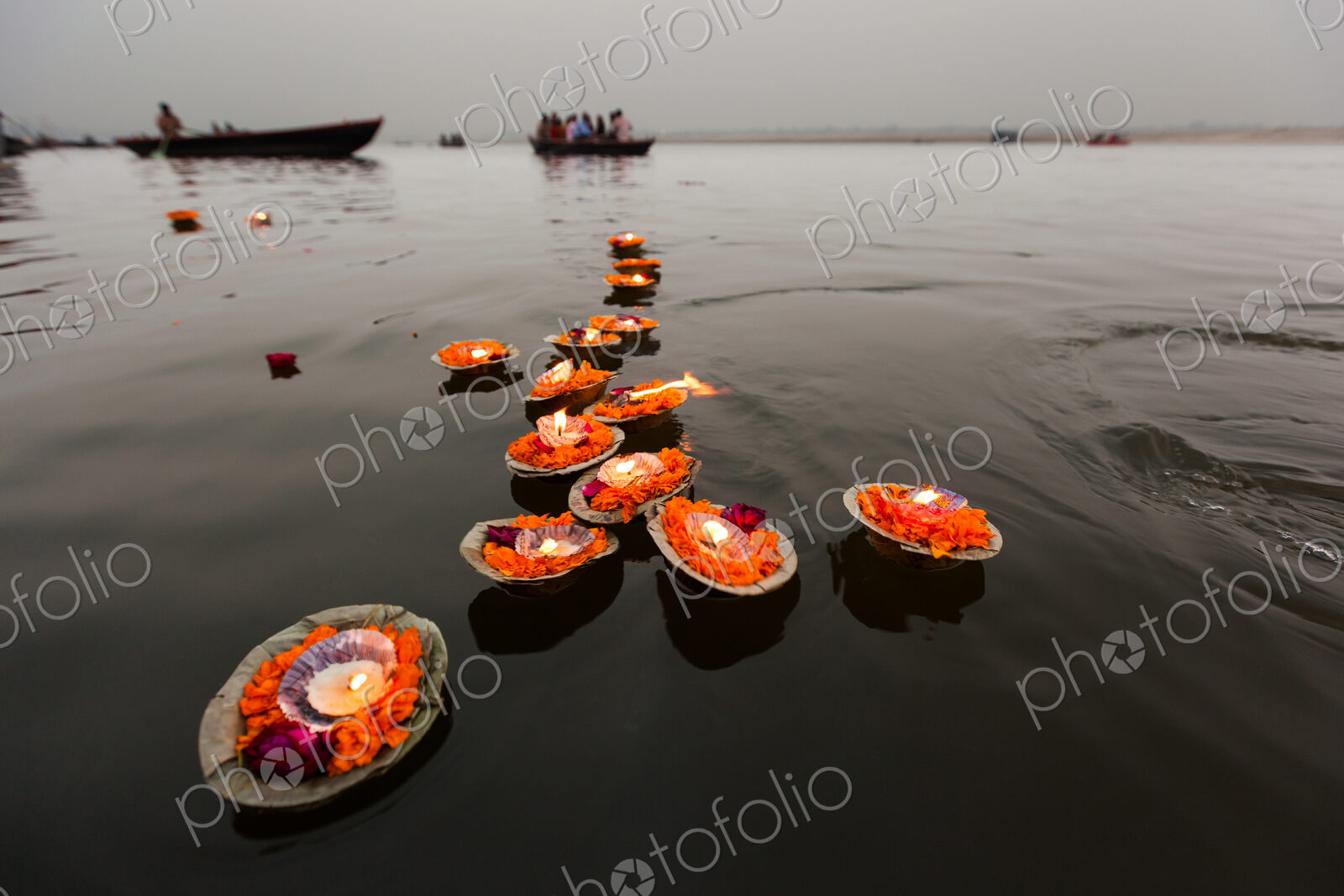 Candles floating in the Ganges River, Varanasi, India