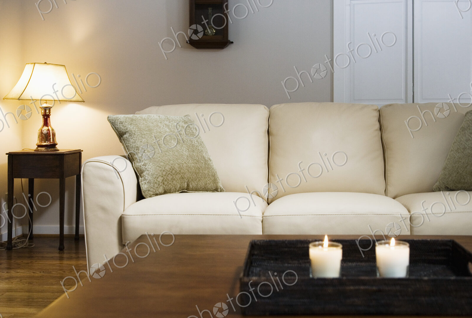 Candles lit on tray in living room