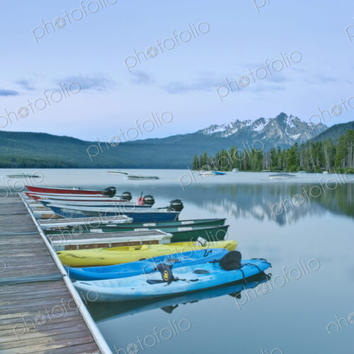 Canoes Docked on a Lake