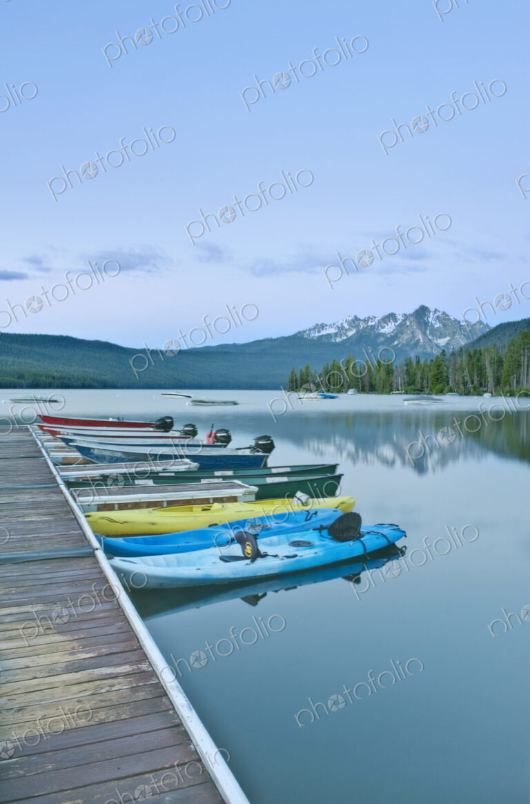 Canoes Docked on a Lake