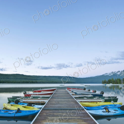 Canoes Docked on a Lake