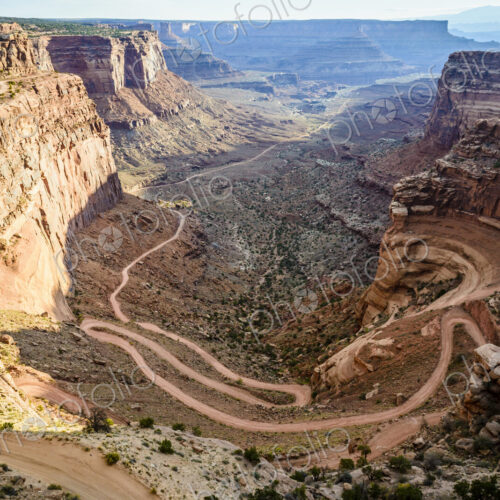 Canyonlands National Park, the view of a zigzag path from the canyon floor up the…
