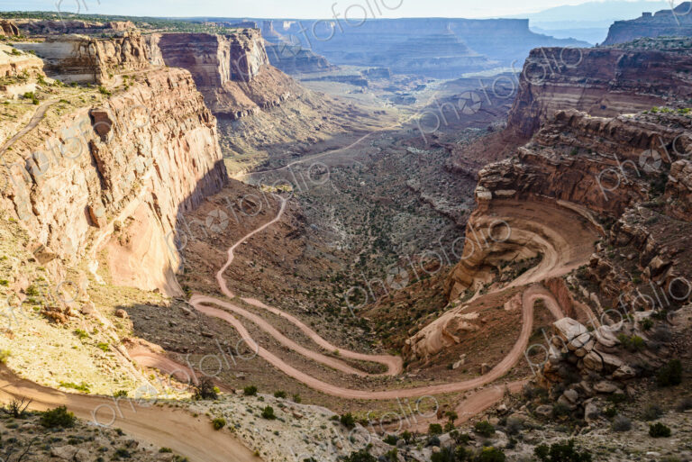 Canyonlands National Park, the view of a zigzag path from the canyon floor up the…