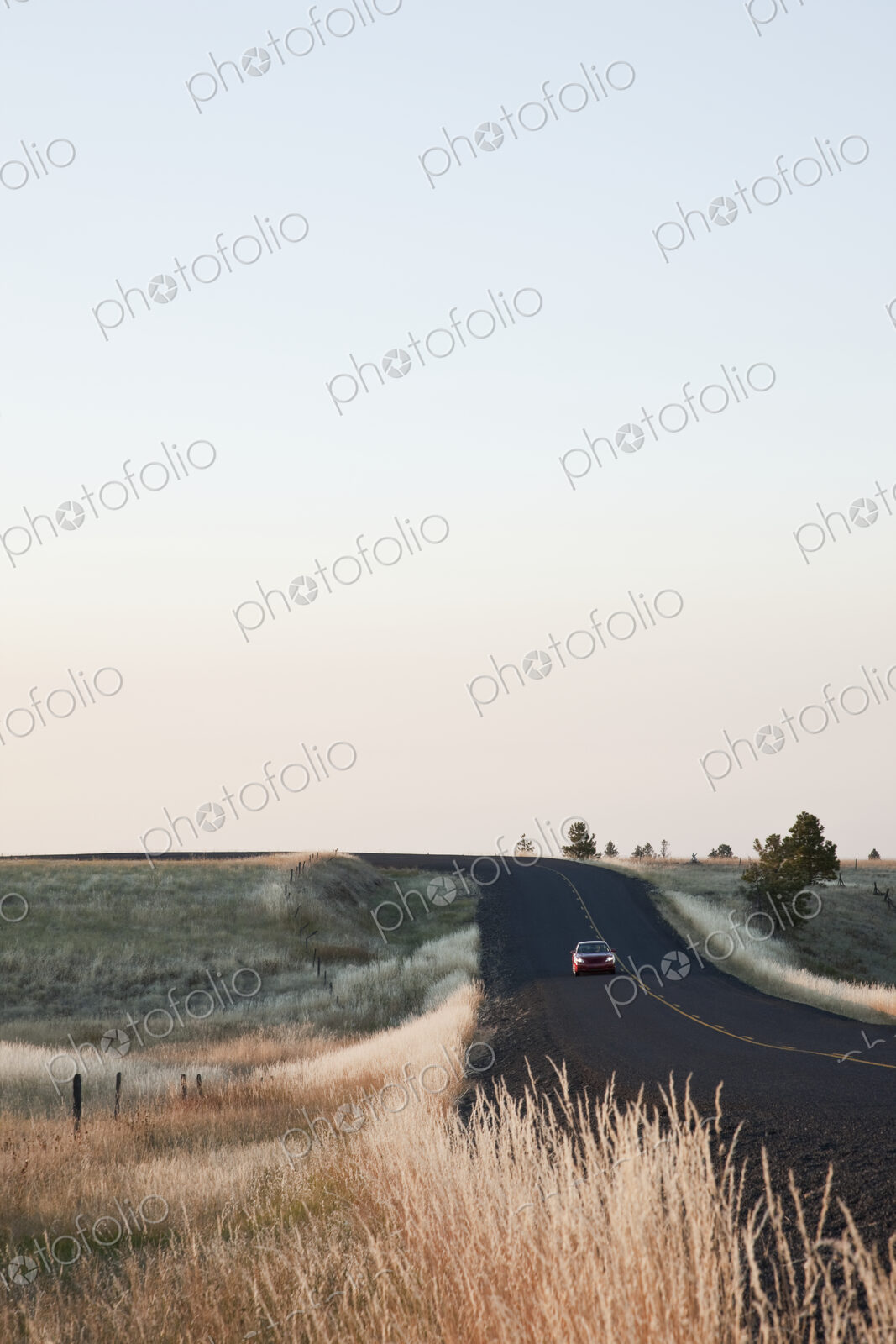 Car driving on rural highway.