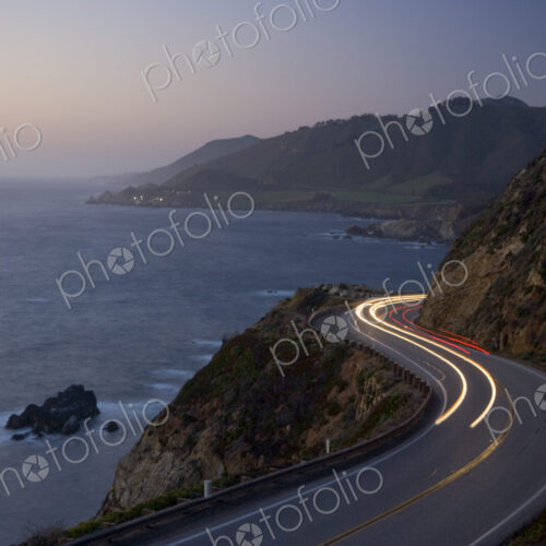 Car headlights on California Highway 1 south of the town of Carmel on the Big Sur… Car headlights on California Highway 1 south of the town of Carmel on the Big Sur…