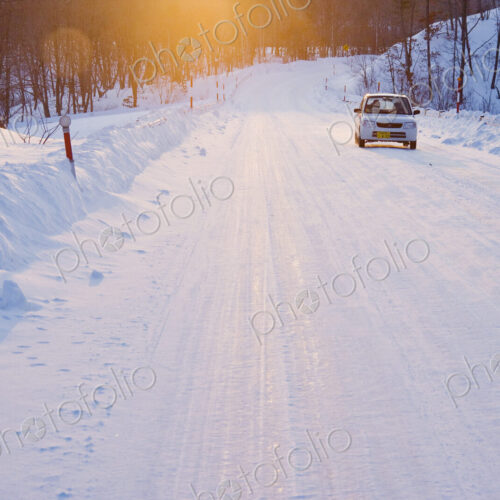 Car on Snow Covered Road Car on Snow Covered Road