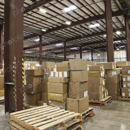 Cardboard boxes and pallets in warehouse Cardboard boxes and pallets in warehouse