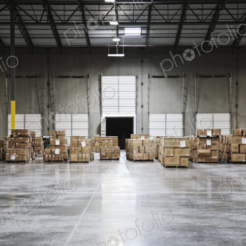 Cardboard boxes at loading dock in warehouse