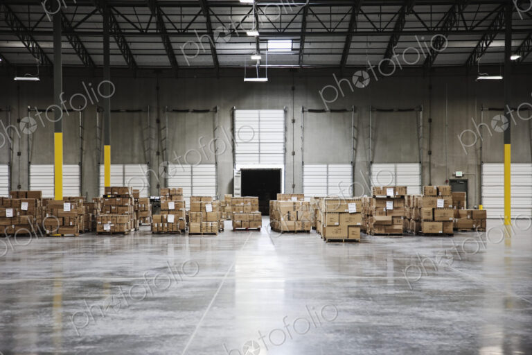 Cardboard boxes at loading dock in warehouse