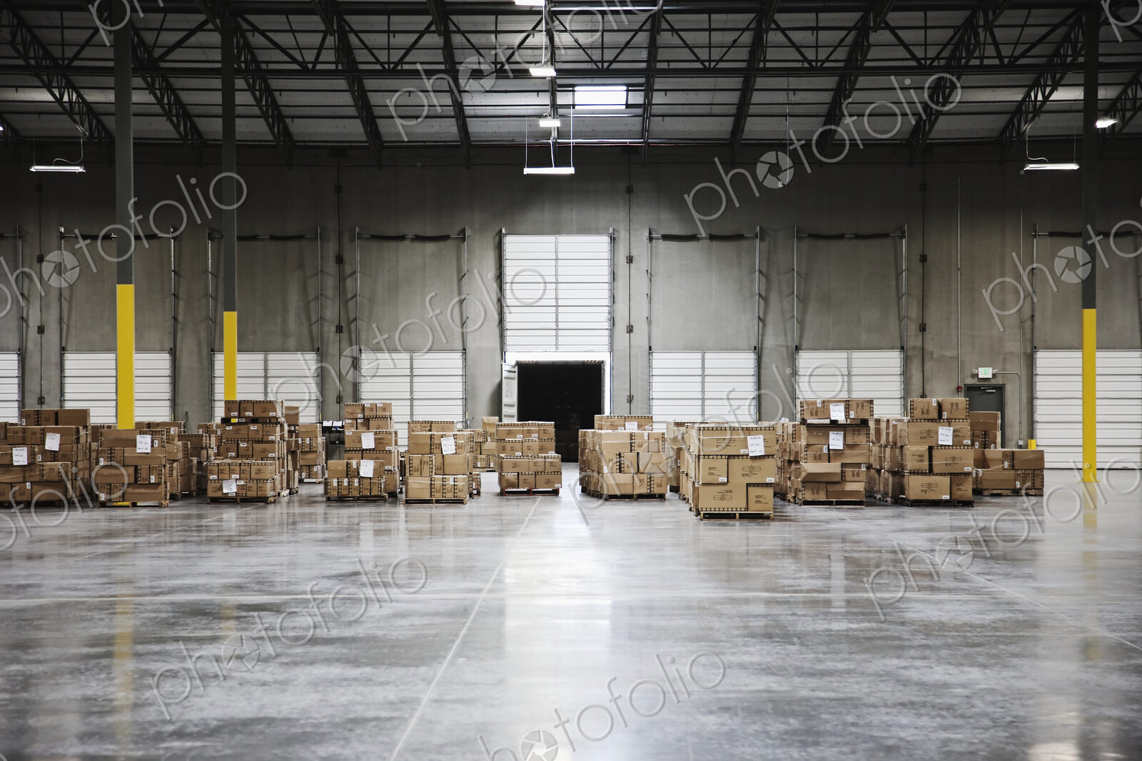 Cardboard boxes at loading dock in warehouse