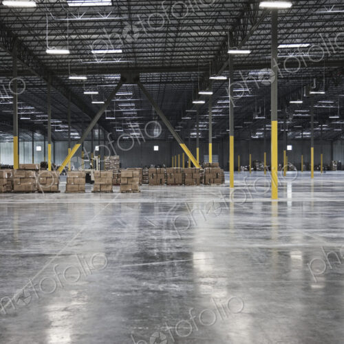 Cardboard boxes in distance in warehouse