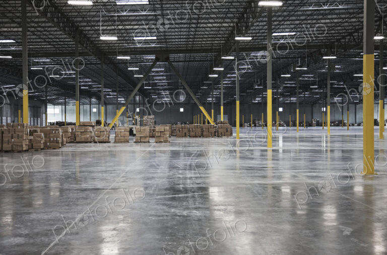 Cardboard boxes in distance in warehouse