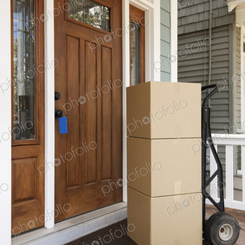Cardboard boxes on front porch of house Cardboard boxes on front porch of house
