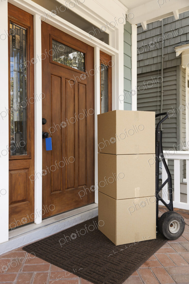 Cardboard boxes on front porch of house
