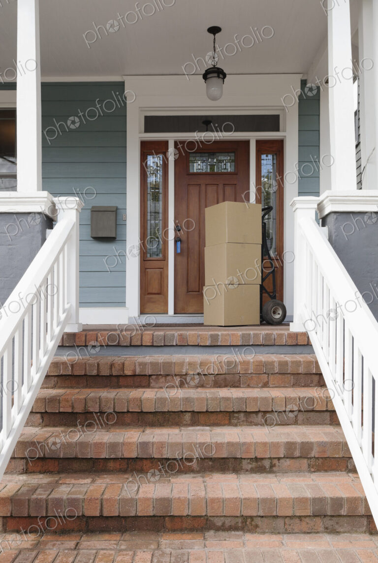 Cardboard boxes on front porch of new house