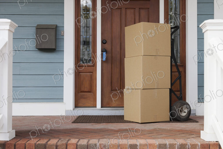 Cardboard boxes on front porch of new house