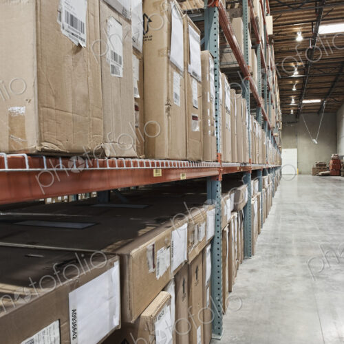Cardboard boxes on shelves in warehouse Cardboard boxes on shelves in warehouse