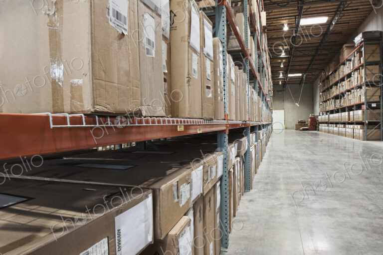 Cardboard boxes on shelves in warehouse