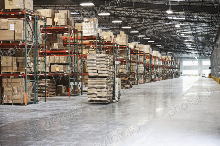Cardboard boxes on shelves in warehouse