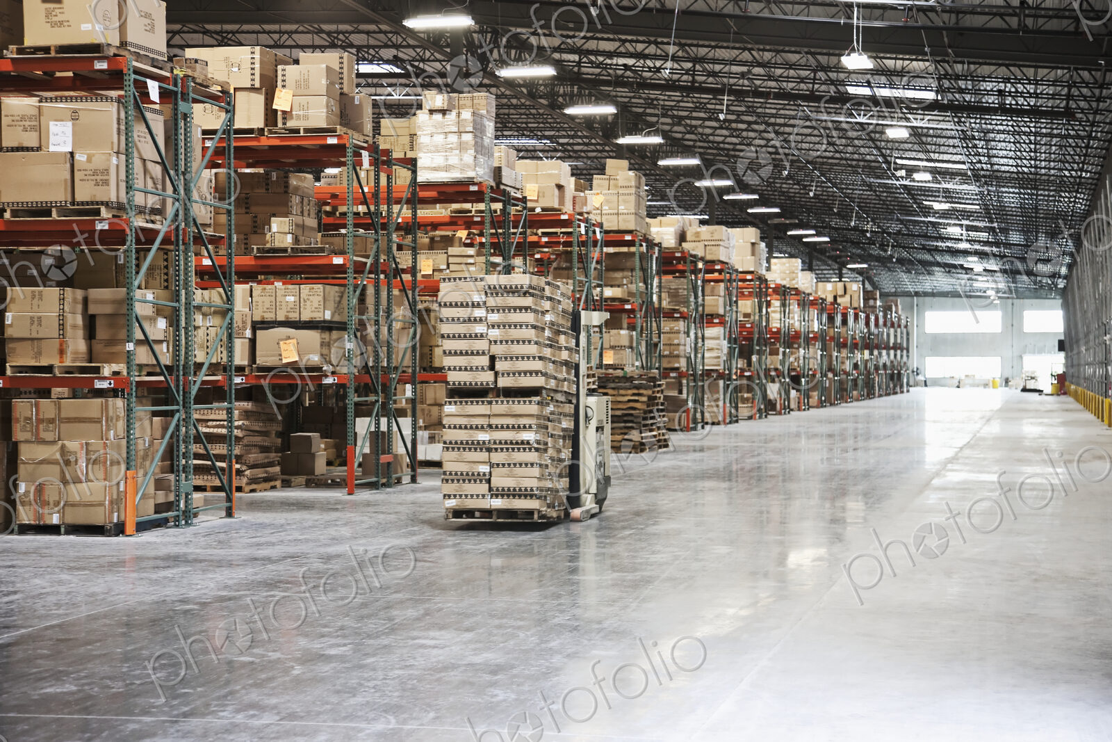 Cardboard boxes on shelves in warehouse