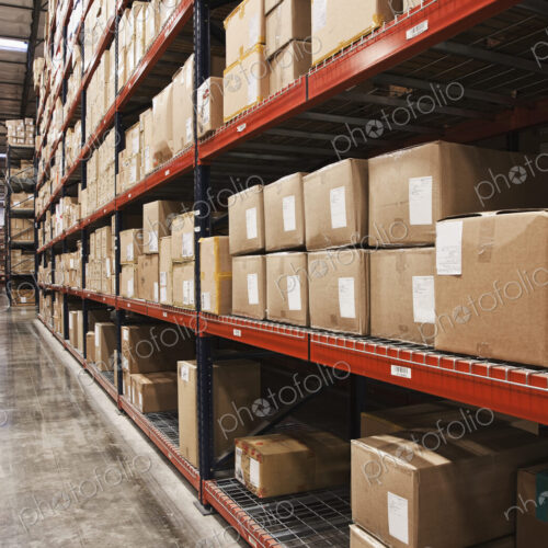 Cardboard boxes on shelves in warehouse
